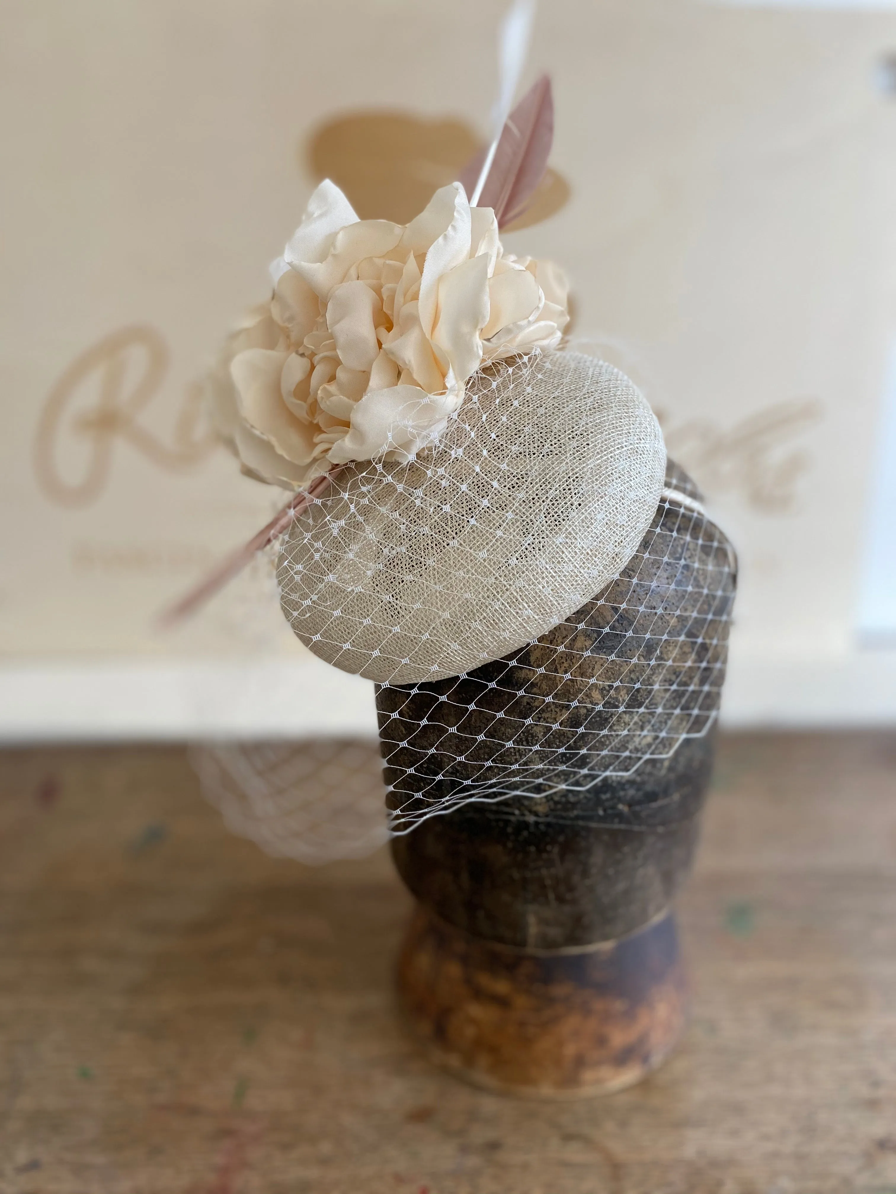 Cream rose and veiling hatinator- for weddings